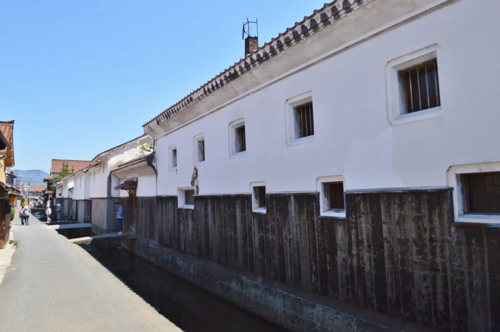 White-walled storehouses beside a canal in Kurayoshi, Tottori