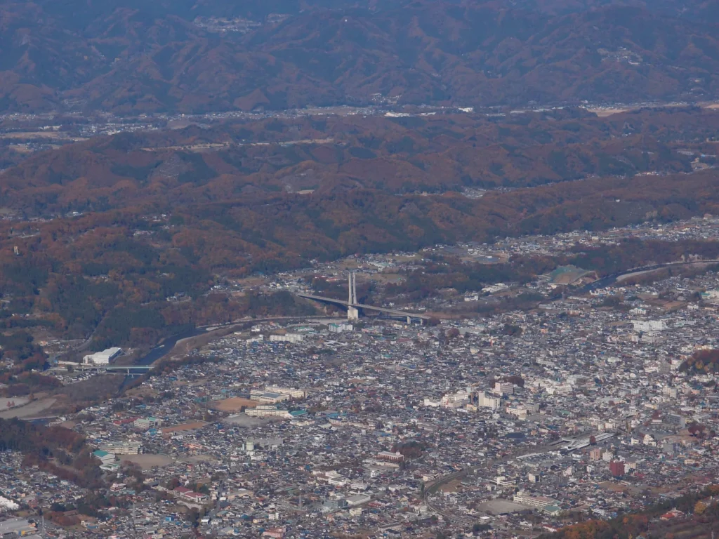 The summit area of Mount Buko above Chichibu, with the city spread out on the plain below