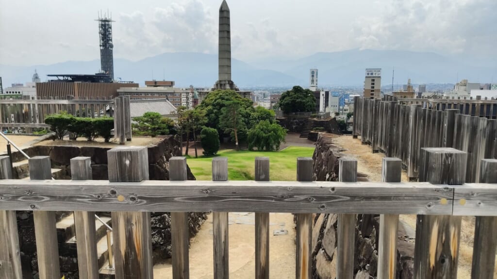 The city of Kofu and the surrounding mountains seen from the ramparts of Kofu Castle