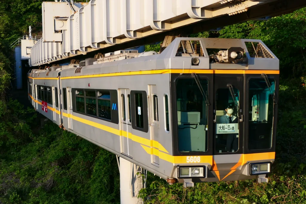 A Shonan Monorail car hanging beneath its track on the Ofuna to Enoshima line