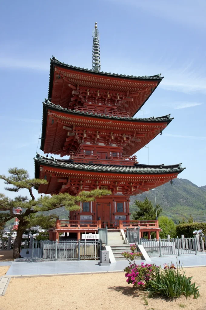 The vermilion three-storey pagoda of Saikoji temple in Tonosho under a blue sky
